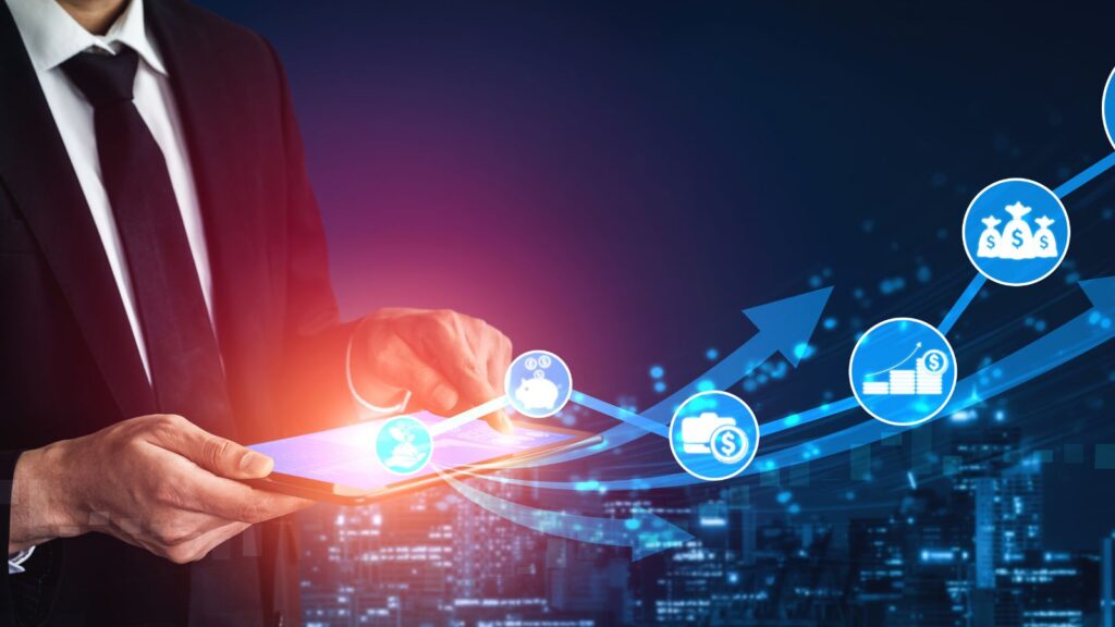 Business professional using a tablet with digital icons of money, savings, and growth arrows, symbolizing business profit growth and financial success.