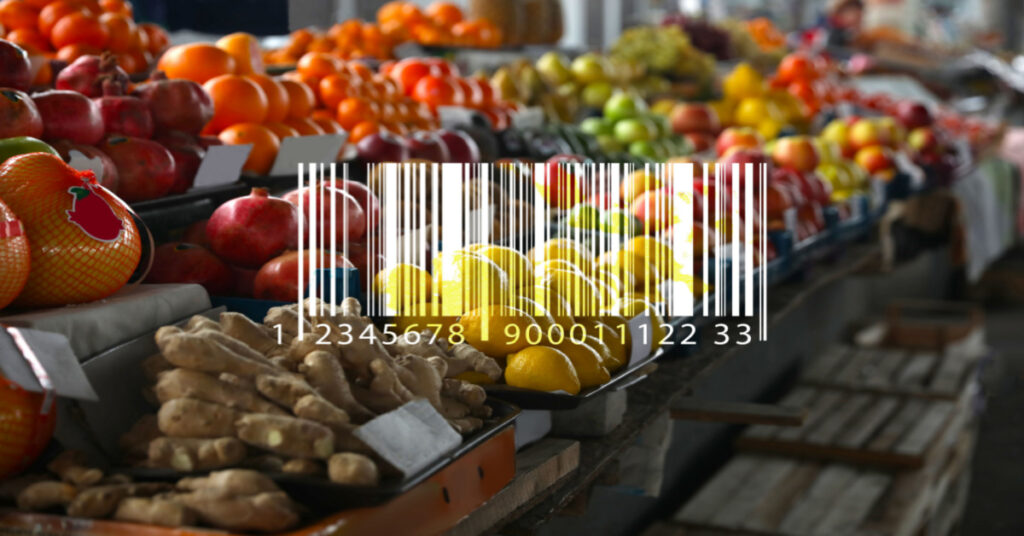 Barcode and tasty fresh fruits on counter at the wholesale market - Recall and Traceability Compliance