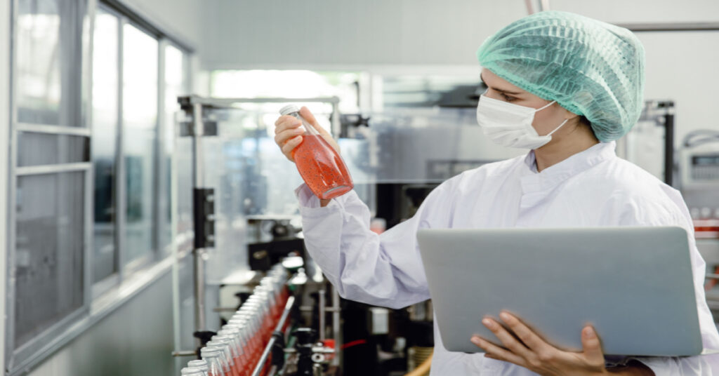 Compliance with quality control and food safety inspectors test and check product contamination, a standard in the food and drink factory production line with hygiene care.
