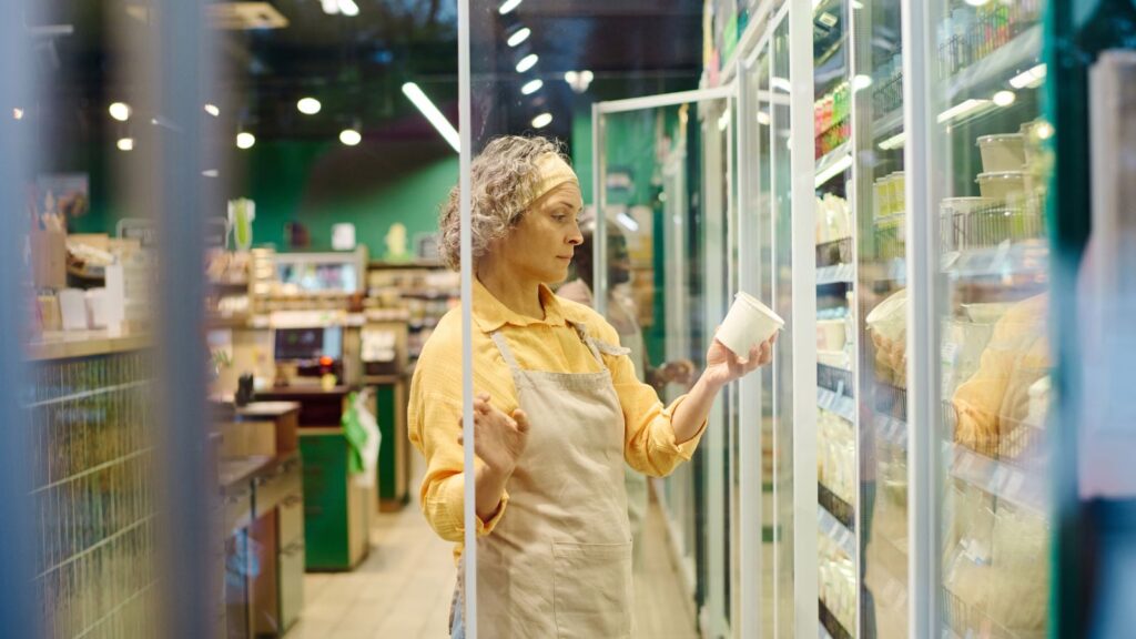 Supermarket Worker Checking Expiration Dates