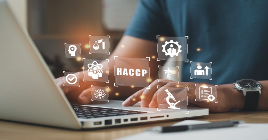 Businessman using a computer to measure HACCP - Hazard Analysis and Critical Control Points, in an ERP system to manage food safety.