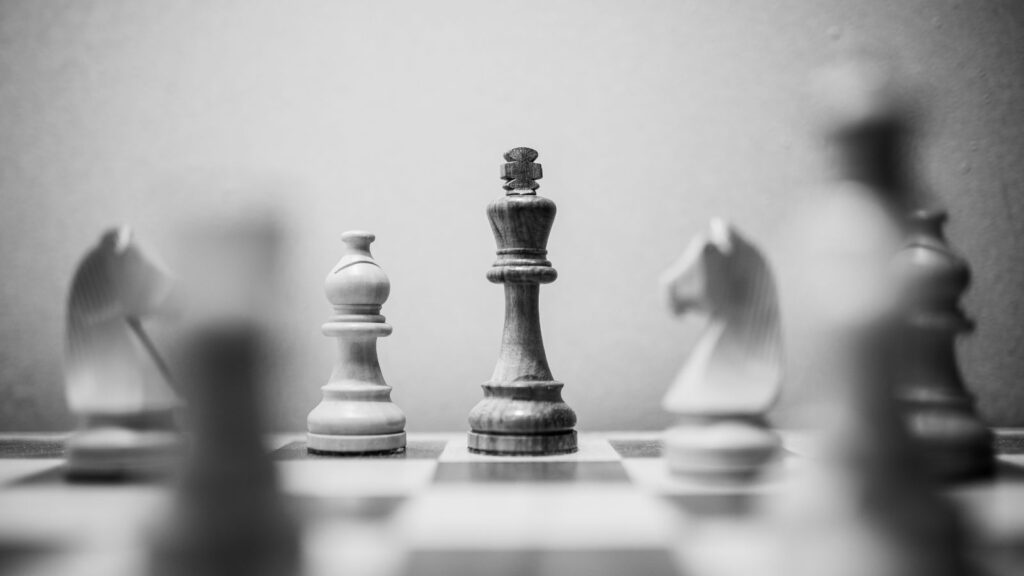 A Dynamics NAV to Dynamics 365 BC ERP Migration Strategy 6 Strategic planning concept with chess pieces symbolizing a Dynamics NAV to Dynamics 365 Business Central ERP migration strategy.