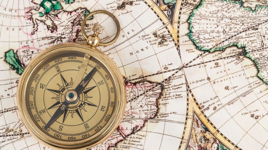 Business Central Multi-Entity Management: Simplifying Global Financial Operations 1 Antique compass on a vintage world map symbolizing navigation and direction—representing global financial control and coordination in Multi-Entity Management with Business Central.