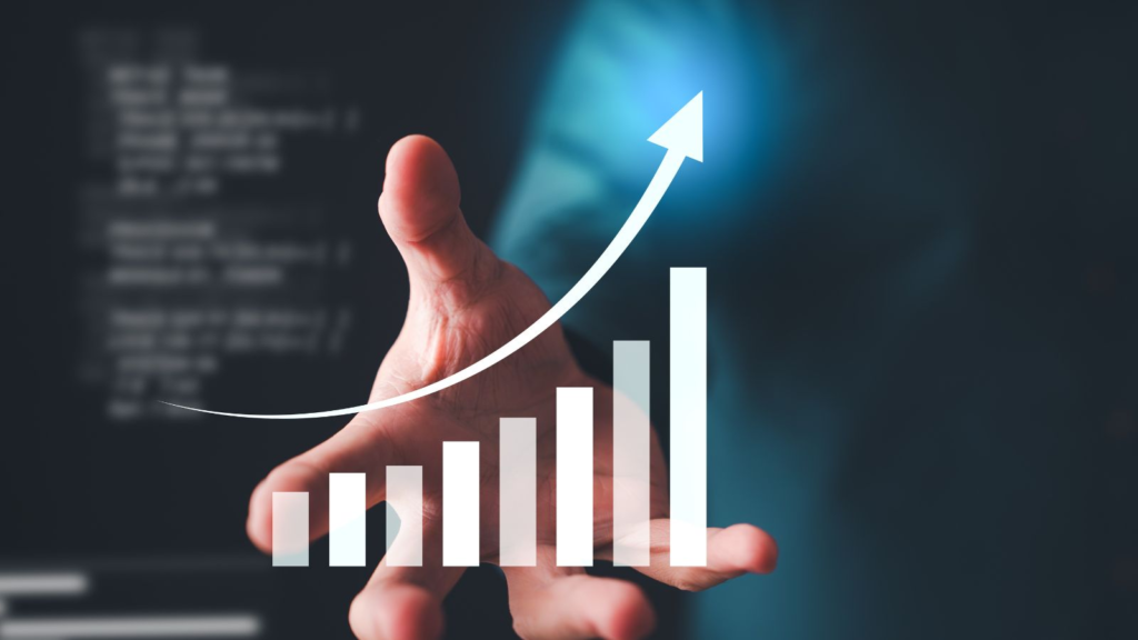 Hand presenting upward growth chart with rising bars and arrow, symbolizing business performance, analytics, and growth strategy