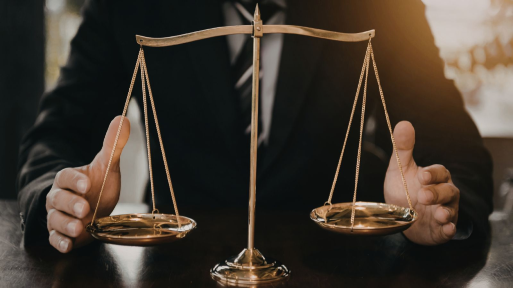 Business professional holding balanced scale, symbolizing governance, risk management, and decision-making in enterprise strategy